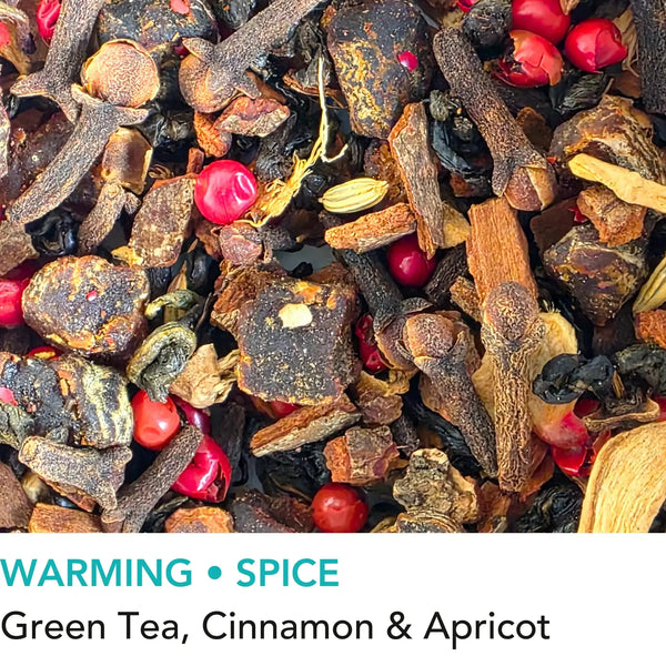 Bothy Hearth spiced green loose leaf tea with cinnamon ginger and pink pepper from Wander Cuppa. This premium tea is a warming green tea infusion inspired by Scottish fireside moments, perfect for a comforting cuppa tea or afternoon tea in Scotland. As a wholesale tea supplier UK, we provide this vegan tea and full leaf tea for cafes and retail across the UK. High-quality loose leaf tea near me featuring green tea leaves blended with aromatic spices and apricot pieces.