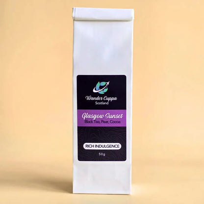 Glasgow Sunset black loose leaf tea from Wander Cuppa featuring rich cocoa beans and pear pieces. This premium tea is a decadent Scottish blend with rose petals and cornflower blossoms, ideal for a cosy afternoon tea or evening treat. As a wholesale tea supplier UK, we provide this vegan tea and full leaf tea for retail and cafes throughout Scotland and the UK. Authentic loose leaf tea near me with indulgent chocolate and fruit notes.