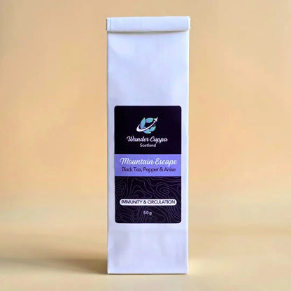Mountain Escape chai loose leaf tea from Wander Cuppa featuring a bold blend of black tea, cassia bark, and star anise. This premium tea is inspired by rugged Scottish mountains and provides a warming boost for your immune system. As a wholesale tea supplier UK, we offer this spiced vegan tea and full leaf tea for a perfect cuppa tea or afternoon tea. High-quality Scotland tea with black pepper and cocoa beans available for wholesale tea orders across the UK.